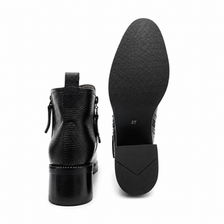 Botines 6565 de cuero para mujer color Negro, vista posterior y de la suela